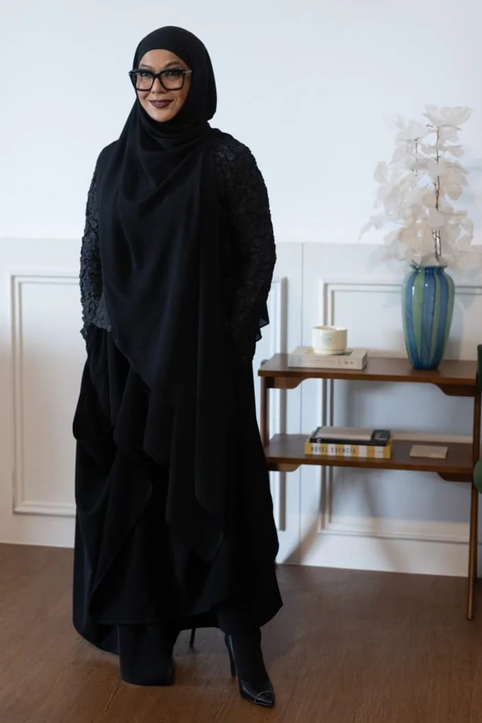 Annie Yahaya standing in a black coat